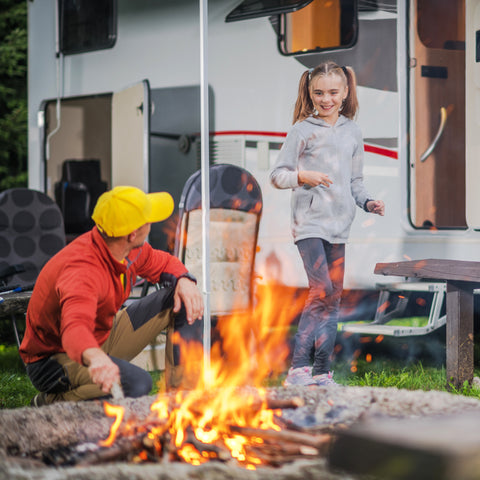 Whispering Hills RV Park making a fire dad and daughter