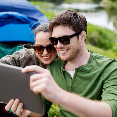 couple on their ipad andd newly installed wifi at Pomona RV Park 