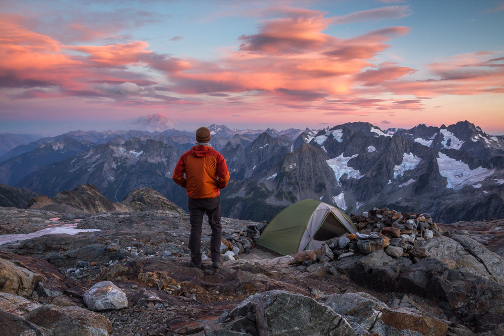 Hiker Overlooking Sunset View of North Cascades National Park