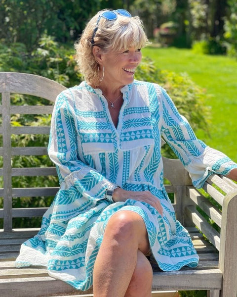 https://cdn.shopify.com/s/files/1/0448/4880/8086/files/jacquard-print-tiered-dress-turquoise-and-cream-777759_1024x1024_2x_2660784e-2e31-4eae-944a-6aec0df95553_600x600.jpg?v=1653473683