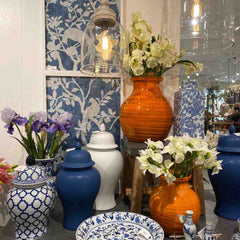 Blue and white vases with bright orange accent colors