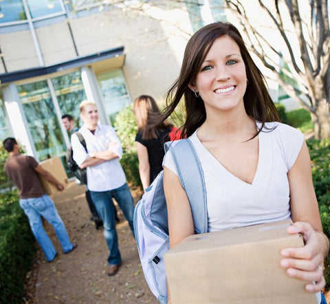 College girl moving into dorm building