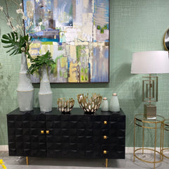 Sage green walls with matte black console