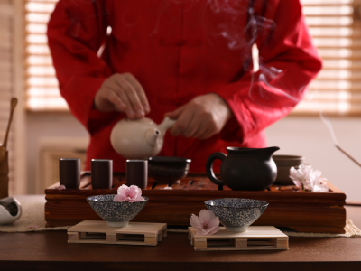 Person performing Gong Fu Chinese tea ceremony