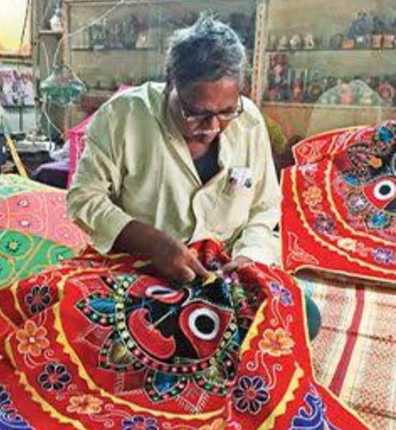 Indian artisan doing applique work