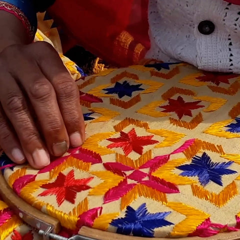 Indian artisan doing Phulkari embroidery