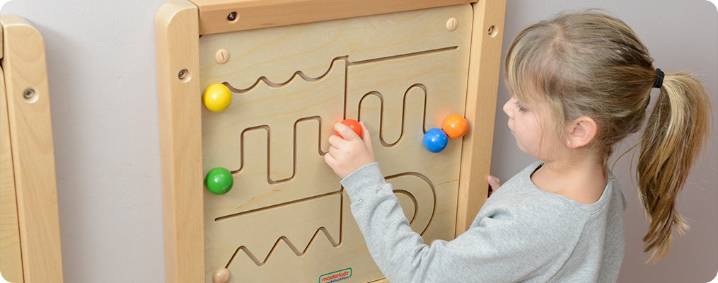 A sliding maze game to help develop fine motor skills together with shape recognition. This product features different types of waves, a spiral and straight lines.  Made from sturdy European wood, the maze board can be used either wall mounted or with the Masterkidz Free-standing Painting Window. Made from Russian Birch plywood and Beech Wood wood. 