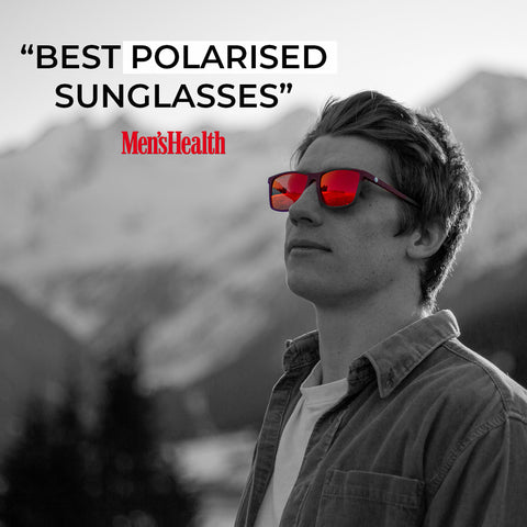 Man stood on Ski mountain in red polarised sunglasses