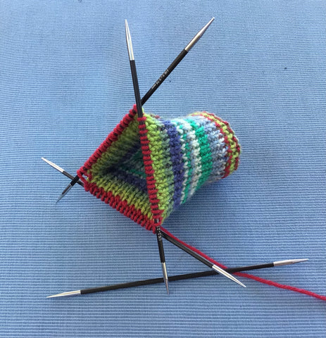 Knitting socks using double pointed knitting needles
