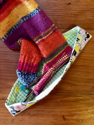 Sock in knitting needle cozy