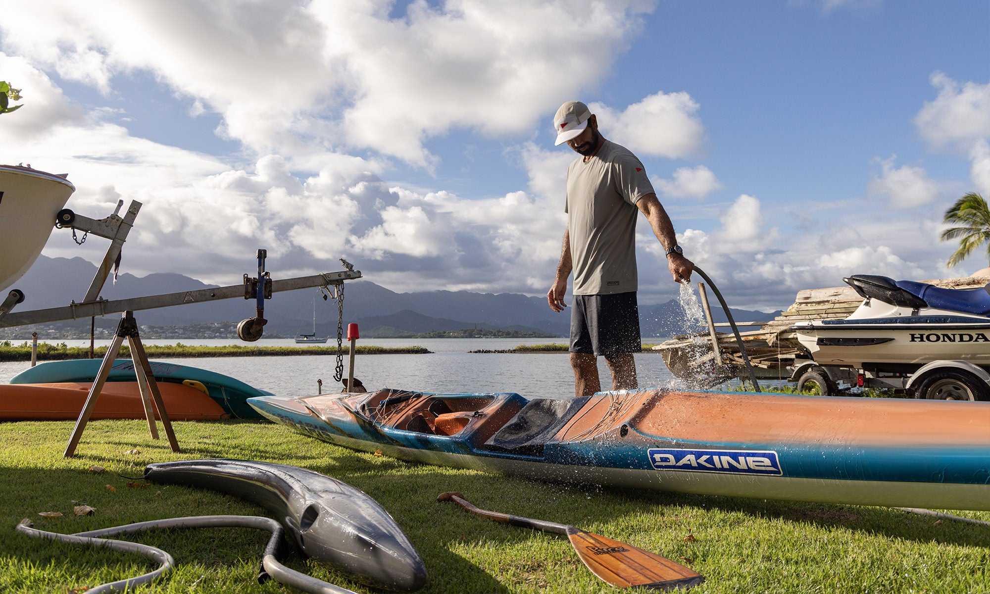 Kirk Ziegler hosing off his outrigger canoe in Hawaii