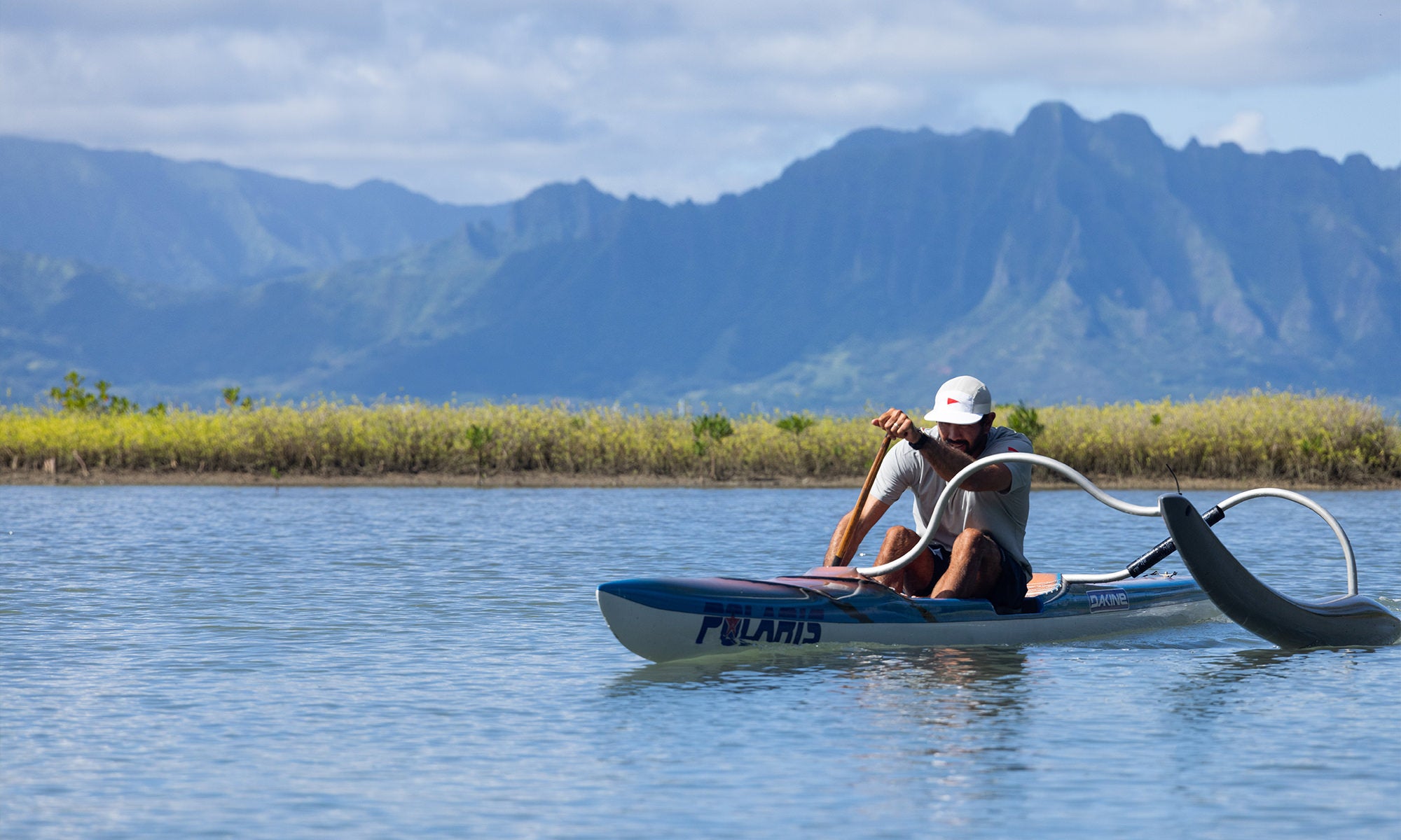 Kirk Ziegler paddling in an outrigger canoe in Hawaii