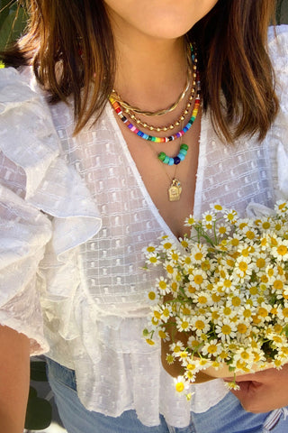 Erica Chan Coffman styling her rainbow Enamel Beaded necklace, made using kit from WomanShopsWorld