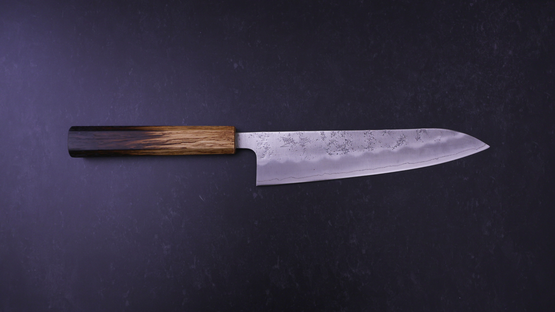 Japanese Kitchen Knife Gyuto against a dark background