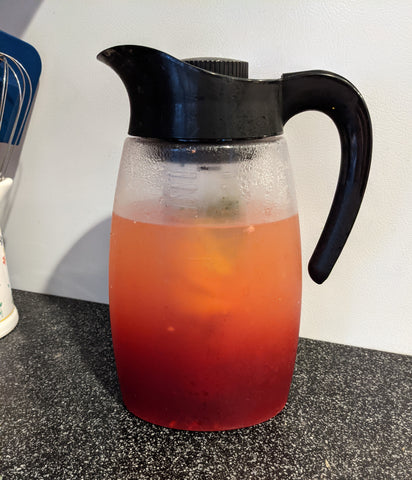 Pitcher of pink lemonade after infusing