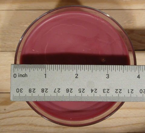 measuring the diameter of a 2-wick candle