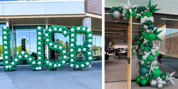 Custom balloon letters spell WSB and green and white balloon arch frame the door