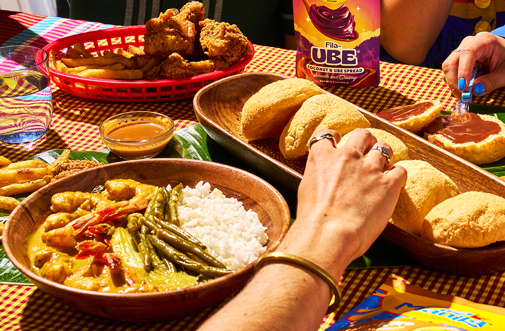 Filipino dishes on a table with Fila Manila products