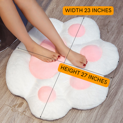 cat paw chair pillow in variant white is shown flat on the floor. over it written over is the product dimension of 23 inches width and 27 inches height
