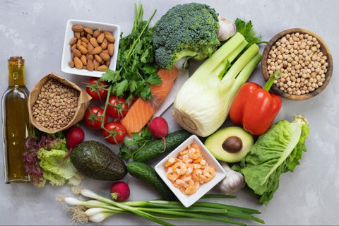 Large plate of colorful vegetables and nuts