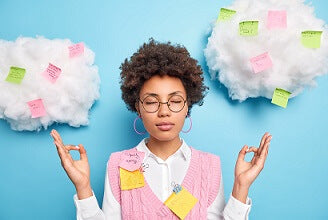 meditating black woman on blue background