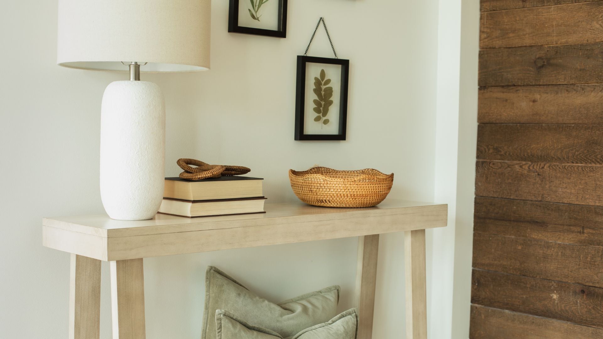 Solid Wood Console Table with Lamp, Books, Decor, and Basket of Pillows Underneath