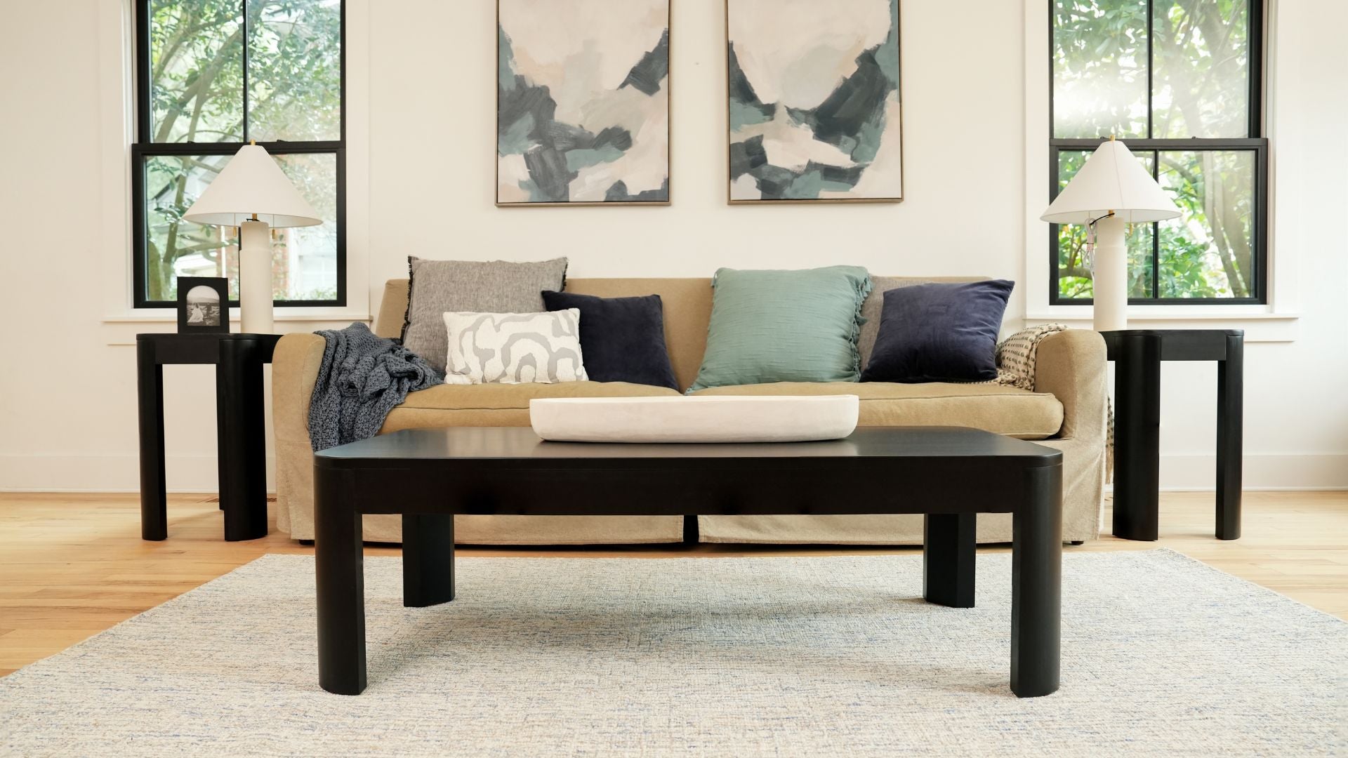 solid wood coffee table with two black side tables