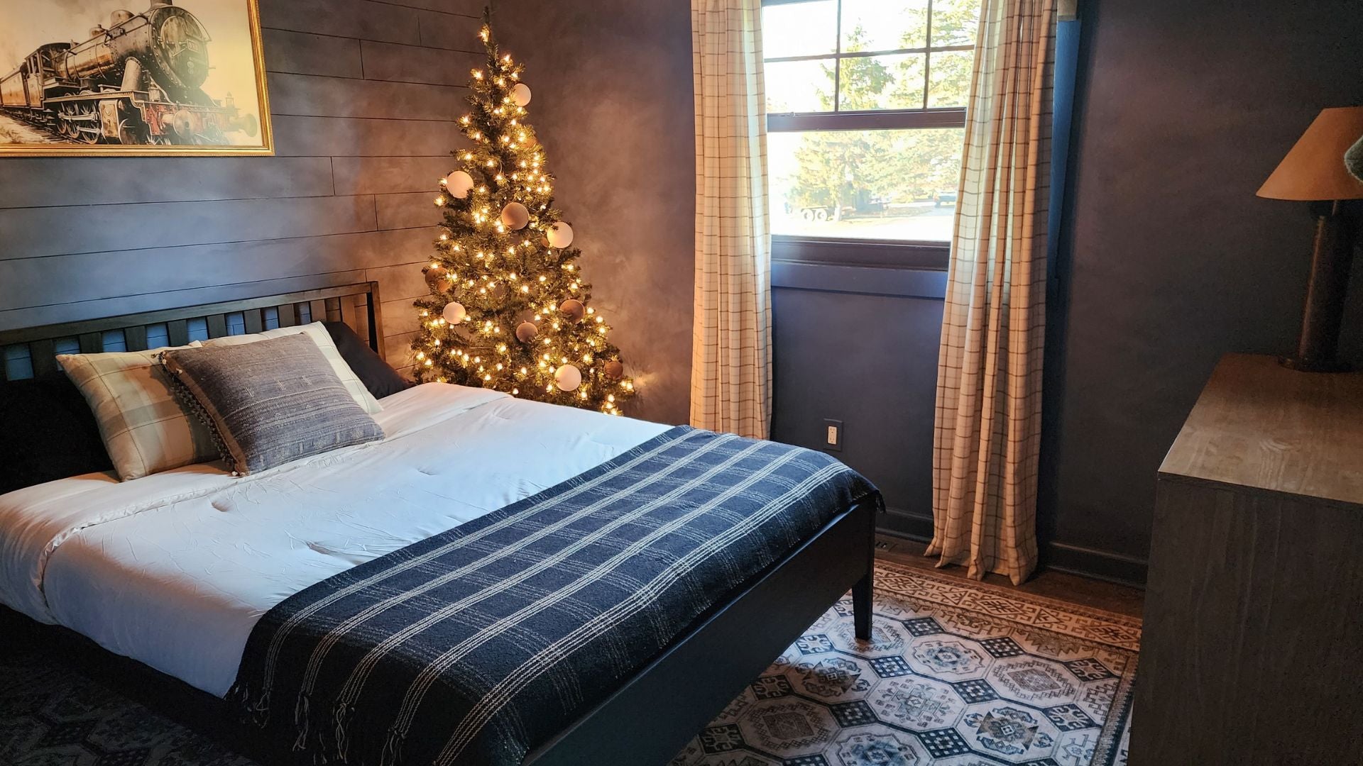 modern queen bed frame in guest room with christmas decorations