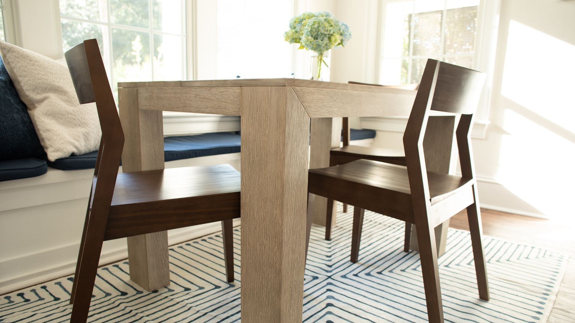 modern kitchen table with walnut dining chairs