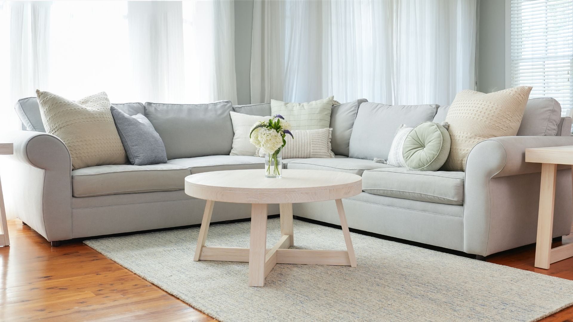 Round solid wood coffee table in white sand wirebrush