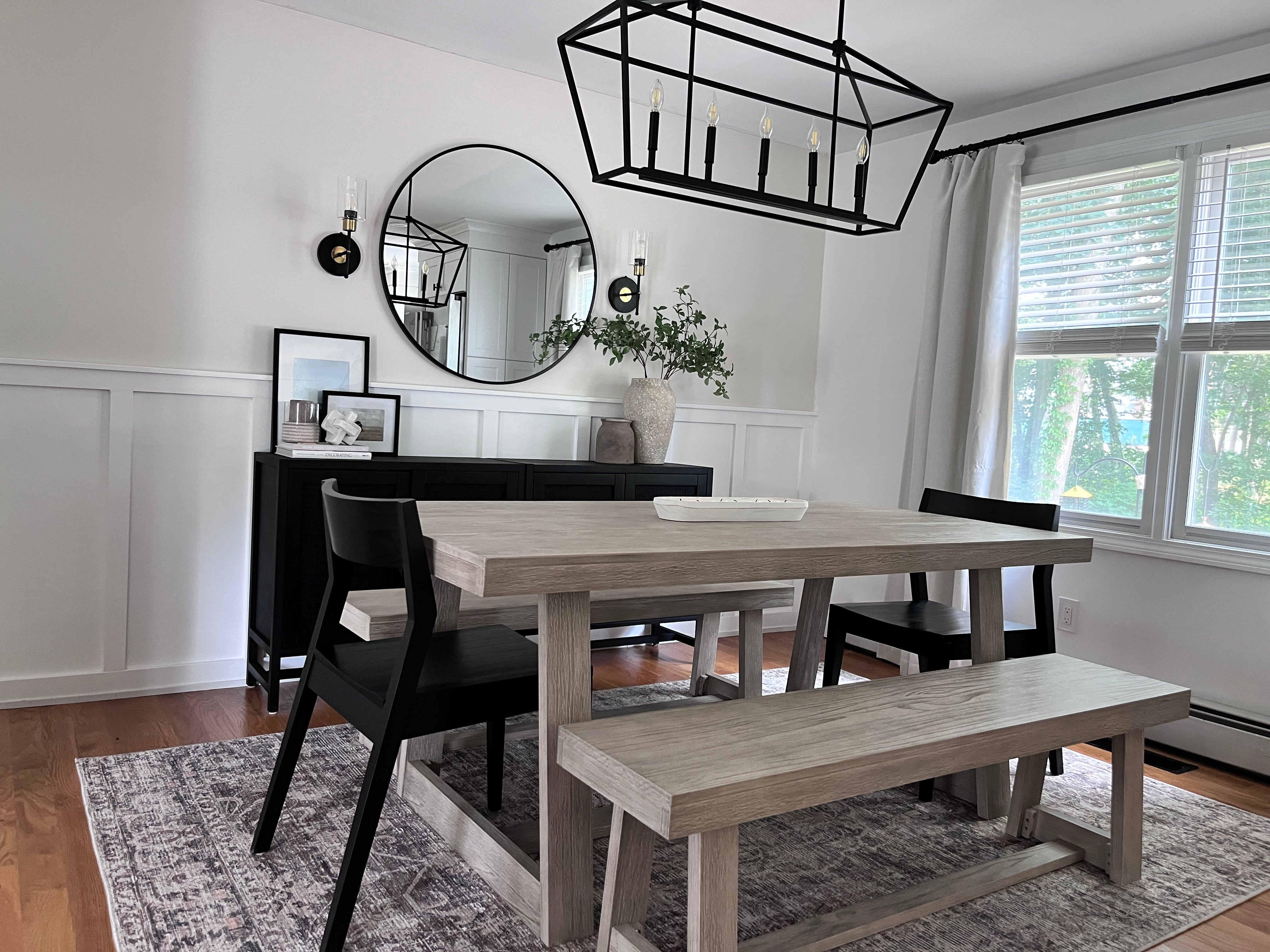 solid wood dining set with benches and black chairs