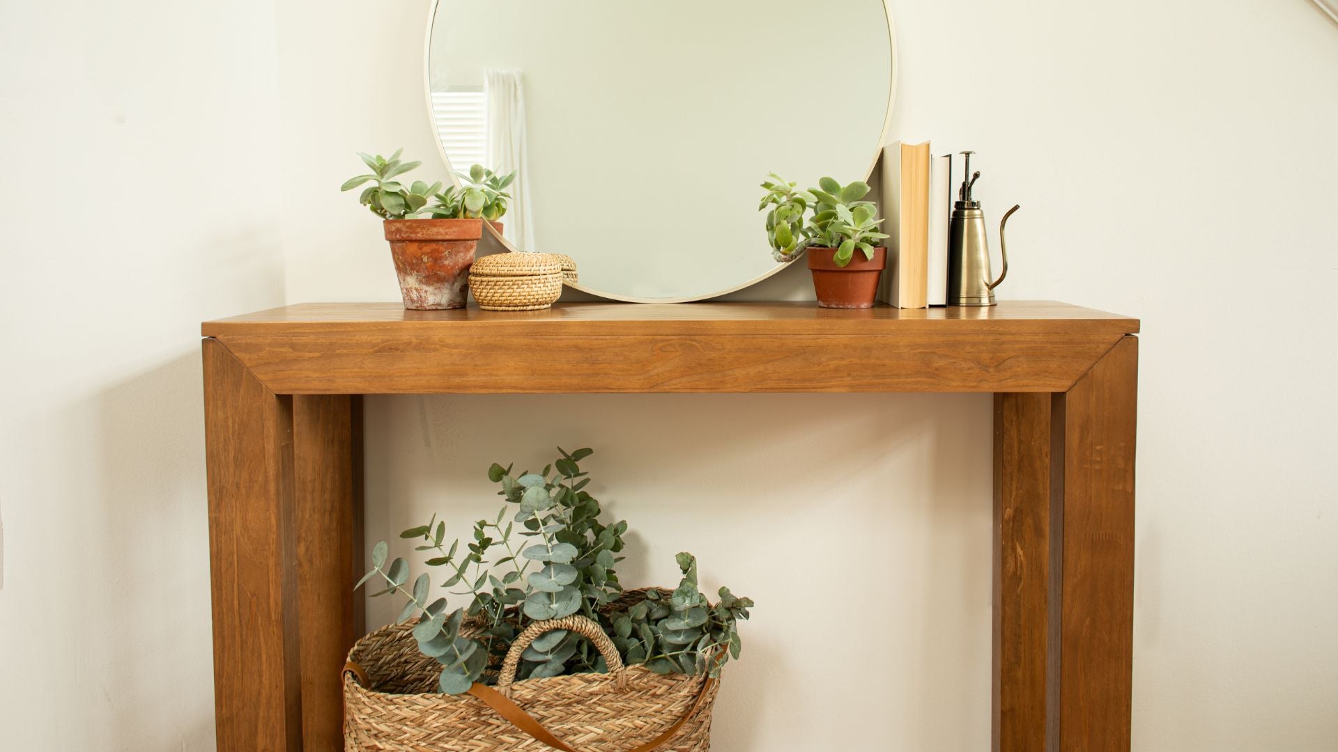 solid wood hallway table with plants