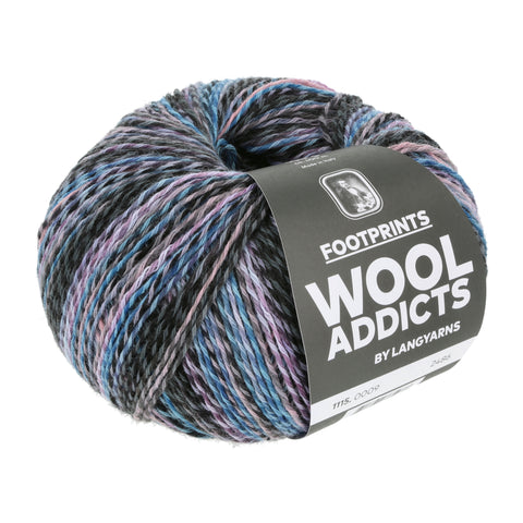 A round ball of Wool Addicts Footprints yarn in a multicolored blue colorway. The wool and cotton blend has a slight barberpole appearance.