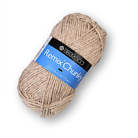 A bullet style skein of Berroco Remix Chunky yarn in a beige color. The color is uniform and it has a nubby texture.