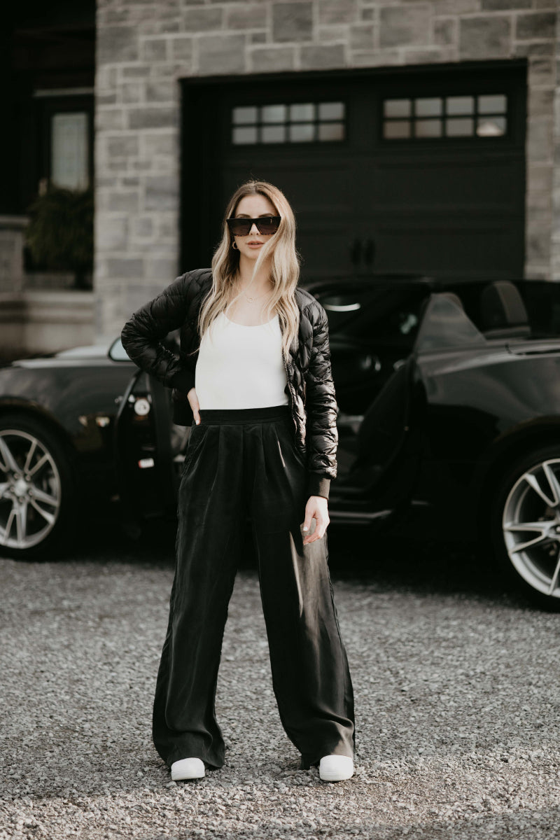 my favourite capsule wardrobe combination of a bodysuit, leather jacket and trouser pants