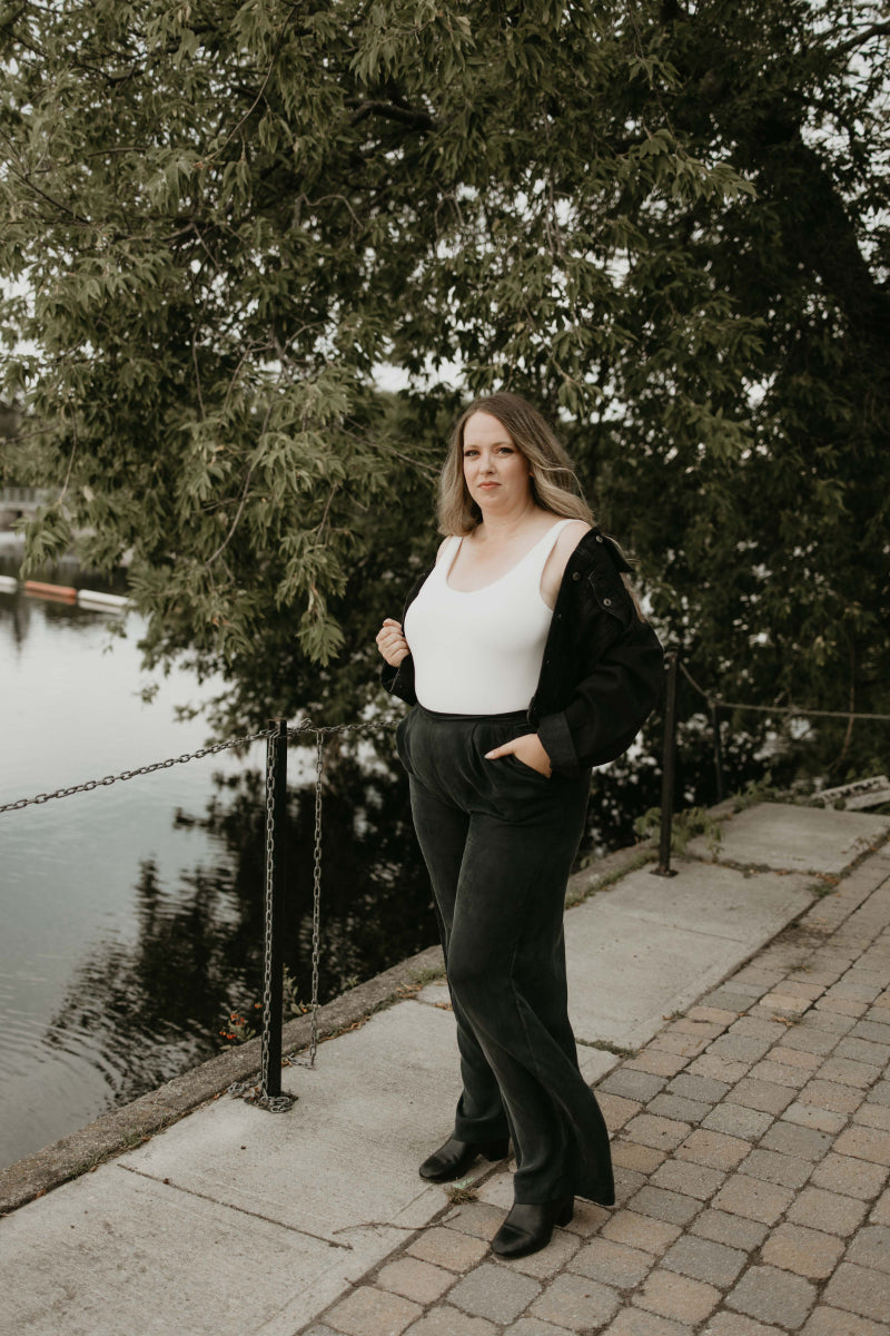 white bodysuit and black pants