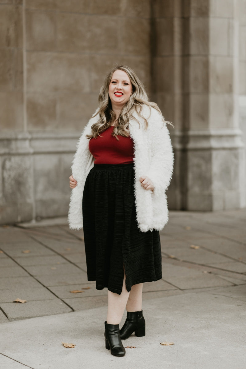 winter outfit with bodysuit fur jacket and skirt