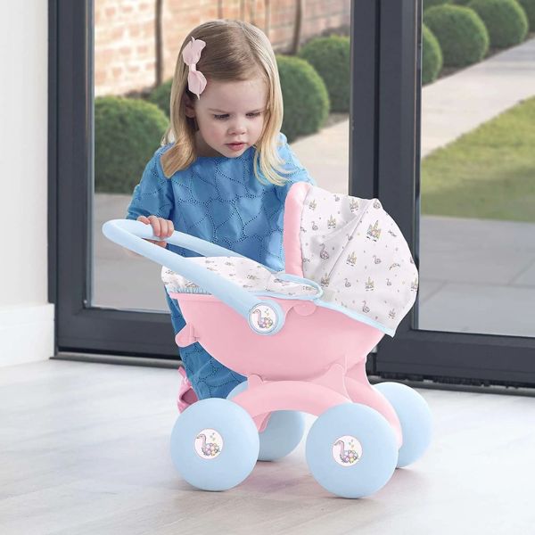 Child attending to doll in dolls pram
