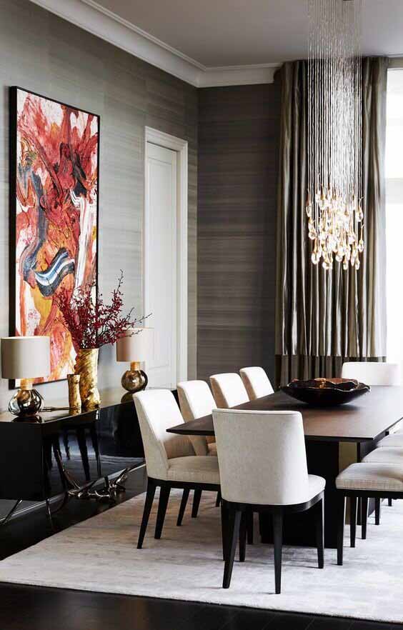 A classy and sophisticated dining room with waterfall-like pendant lights above the dining table I ZenQ Designs