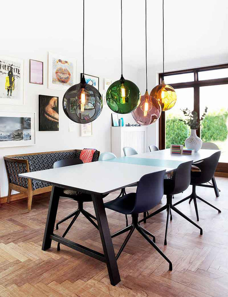Colourful pendant glass ball lights above the dining table I ZenQ Designs