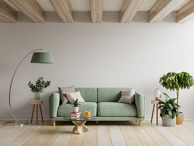 Green sofa in modern apartment with floor lamp - ZenQ Designs