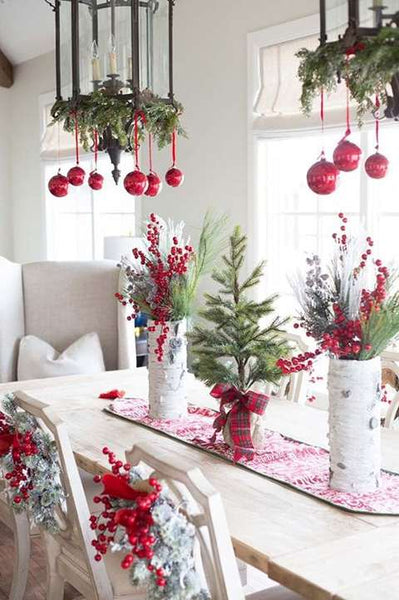 Red Christmas decorations above the kitchen table