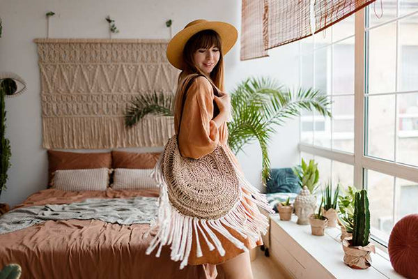 Tassels on the wall and on a wicker bag