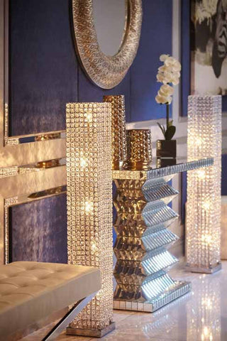 Two luxury floor lamps with crystals next to a golden table I ZenQ Designs