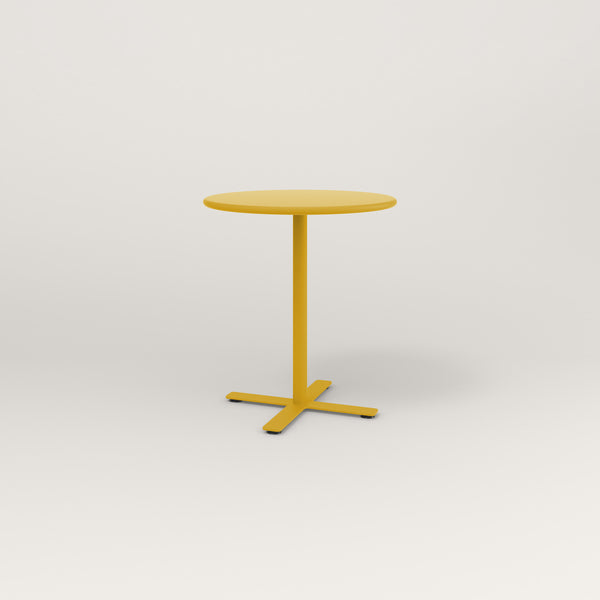 RAD Cafe Table, Round X Base in spun aluminum and yellow powder coat.