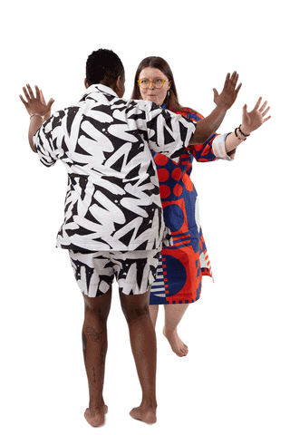 GIF of two people dancing joyously in patterned graphic organic cotton sleepwear 