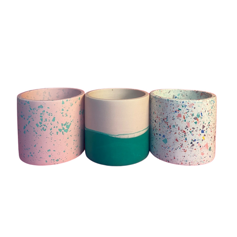 The Custard Tarts jesmonite plant pots in pink and green, green and cream and shite with rainbow colour jesmonite flakes