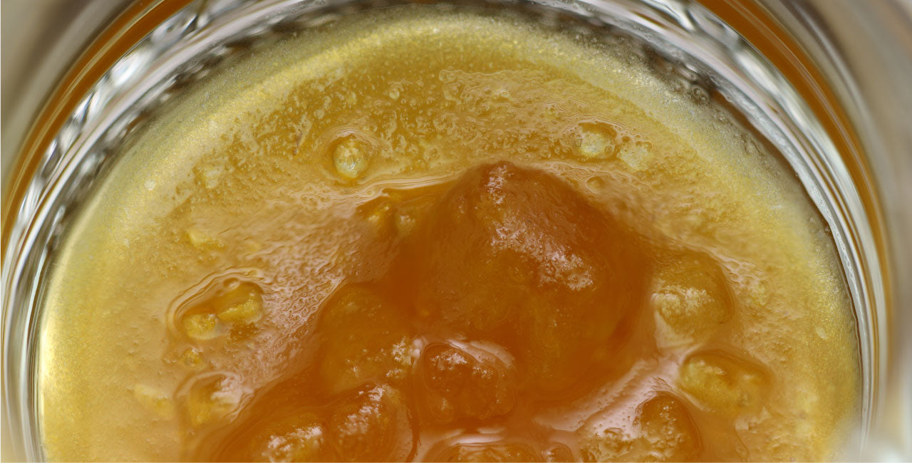 Image of CBG oil in a jar.