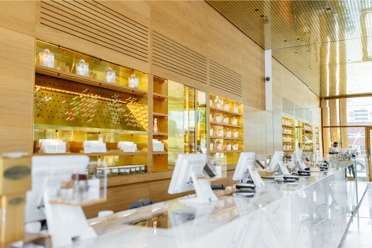 Image of a long counter in a large cannabis dispensary.