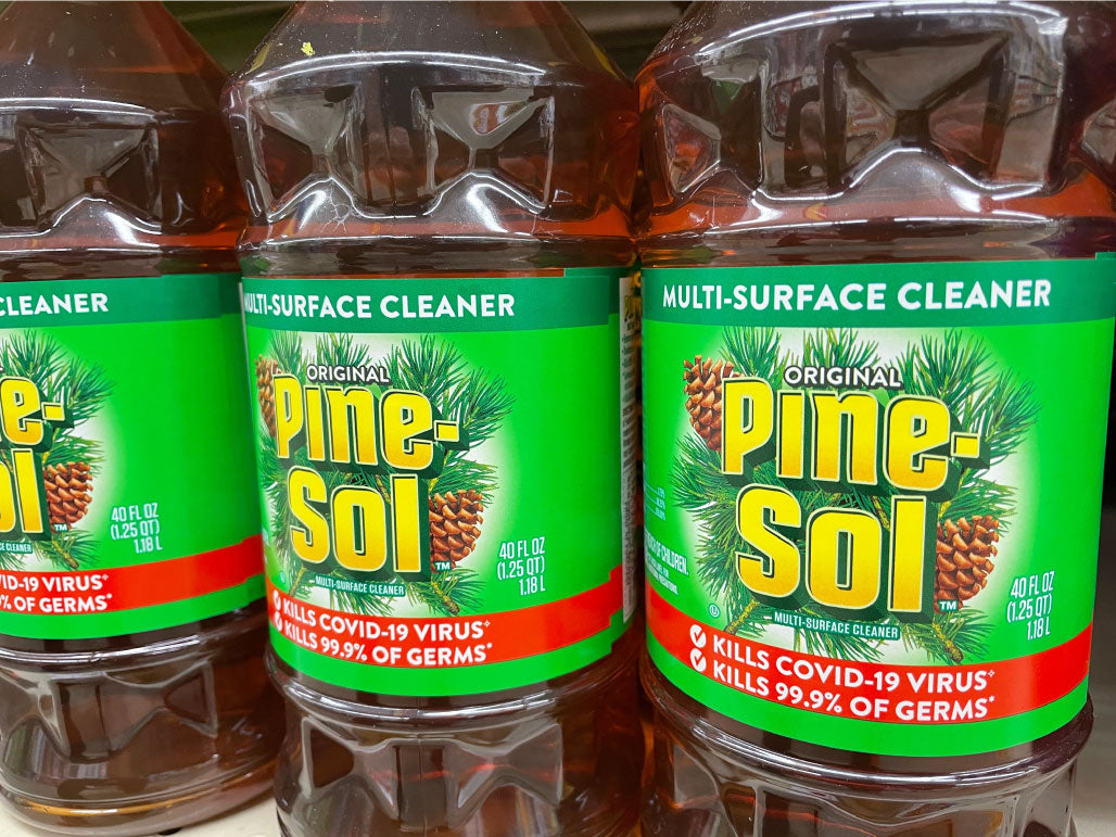 Image of Pinesol cleaner on a shelf in grocery store.